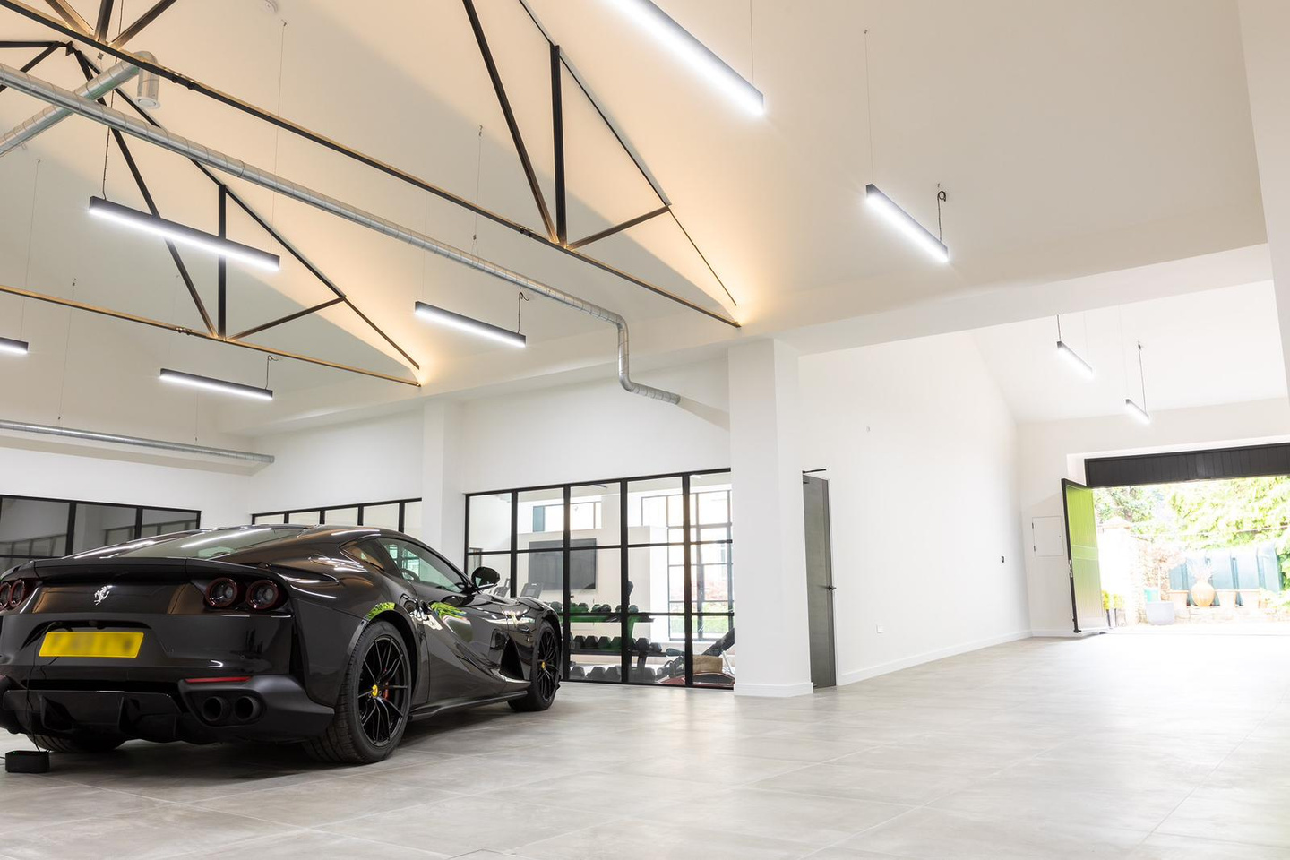 Private Luxury Barn — Wetherby: Ferrari garage, gym, pool and corridor
