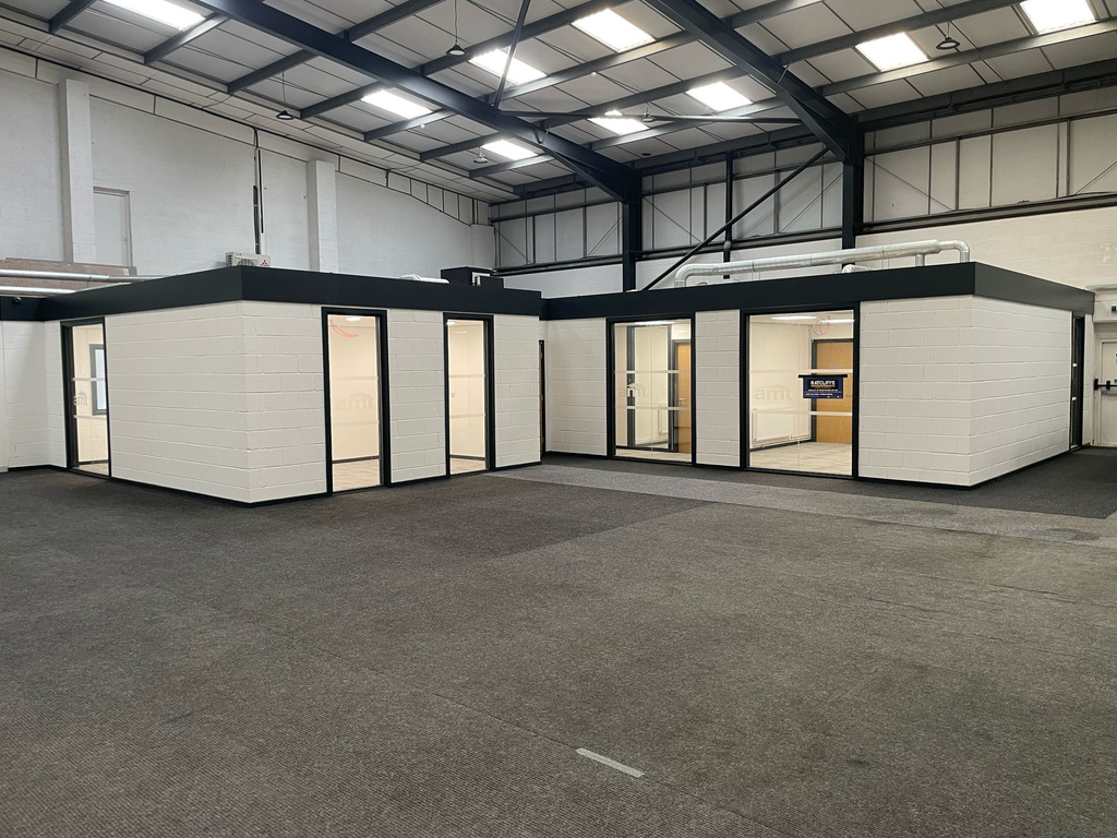 AMT Auto Showroom — office units inside industrial warehouse